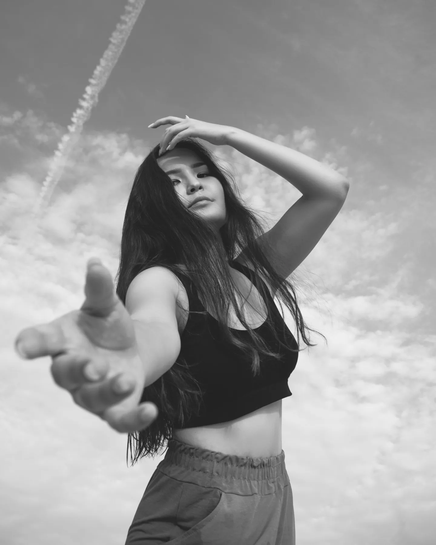 Editorial black-and-white portrait in Dubai, dynamic movement and expression by Photoczaro